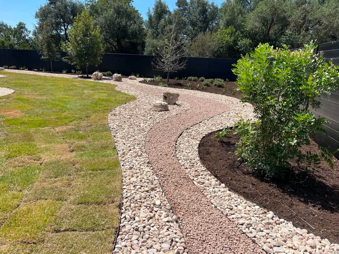 Decorative rock pathway and landscape